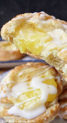 A lemon pastry drizzled with glaze and a big bite taken out of it. Lemon Pie Filling Recipes, Sweet Puff Pastry Recipes, Puff Pastry Cream, Sweet Cream Cheese Filling, Lemon Pastry, Delicious Lemon Desserts, Ar Ideas, Cream Cheese Puff Pastry, Pastries Recipes Dessert