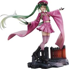 a figurine is posed in front of a white background and has long green hair