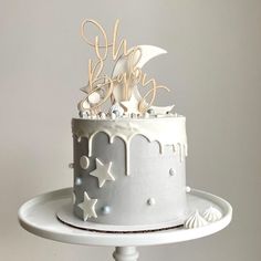 a cake with white frosting and stars on it