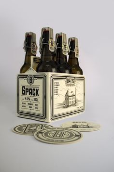 six beer bottles in a box with coasters