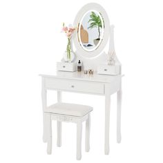 a white vanity table with a mirror and stool