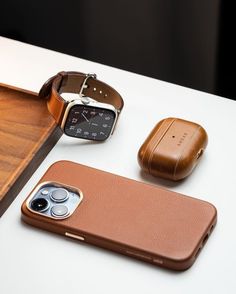 three different types of cell phones sitting next to each other on top of a table