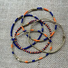 Auburn Bracelets. Made With Blue And Orange Seed Beads. 14k Gold Plated 2mm Beads. Support Your Team! Each Bracelet Is $35 Auburn Bracelets, Navy Bracelet, 2mm Beads, Orange Bracelet, Blue And Orange, Blue Necklace, Auburn, Womens Jewelry Bracelets, Blue Orange