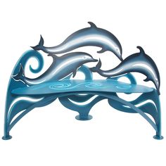 two dolphins are sitting on a bench made out of metal and blue paint with swirls