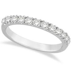 a white gold wedding ring with five stones on the side and four rows of diamonds