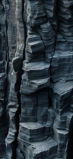 stacks of rocks are stacked high up in the air