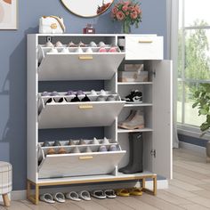 a white shoe rack in a room with blue walls