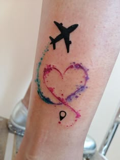 an airplane and heart tattoo on the leg for someone's friend who loves to fly