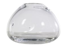 a clear glass vase sitting on top of a white table