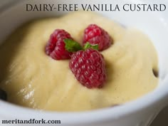 three raspberries on top of a cream sauce in a bowl with the words dairy - free vanilla custard