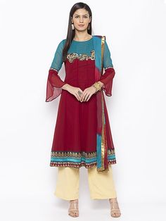 Maroon Turquoise Blue Georgette Kalidar Kurta With Hand Embroidery Below Neckline With Stitching Detailing Of Zari And Thread Around Neckline.. Brocade Detailing On Hemline ..Two Coloured Full Sleeves With Slit At The Bell End Worn With Beige Culottes And Shaded Blue Maroon Chiffon Dup With Gold Border On It. Red Anarkali Suits, Palazzo Kurta, Designer Salwar, Party Pants, Designer Salwar Suits, Wear Red