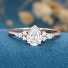 1-0-ct-pear-shaped-moissanite-cluster-engagement-ring-17 Pear Shaped Cluster Engagement Ring, Tear Drop Gold Engagement Ring, Almond Rings Engagement, Almond Shape Wedding Ring, Raindrop Ring Engagement, Rose Gold Engagement Ring Teardrop, Pear Moissanite Ring, Pear Diamond With Side Stones, Pear Shaped Moissanite Engagement Ring