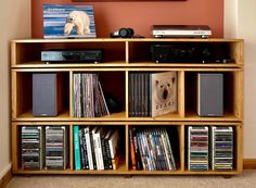 a bookshelf filled with lots of different types of audio equipment