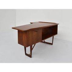 a wooden desk with an open drawer on one side