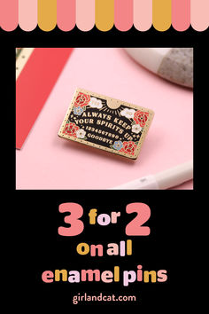 three enamel pins with the words 3 for 2 on each one, and an image of a