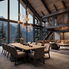 a large dining room table surrounded by chairs and tables in front of glass windows with mountain view