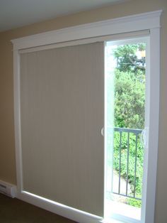 an open sliding glass door in a room