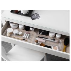 the contents of a makeup drawer are neatly organized and ready to be put into use