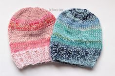 two knitted hats sitting next to each other