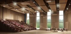 an empty auditorium with rows of seats and people sitting on the floor in front of large windows