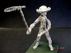 a paper mache figurine holding a baseball bat