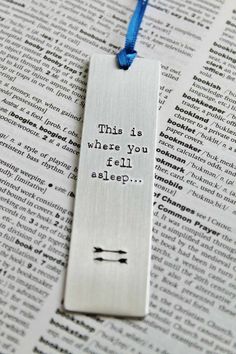 a bookmark that says, this is where you fell asleep on top of an open book