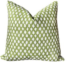 a green and white pillow on a white background