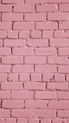 a pink brick wall with no mortar