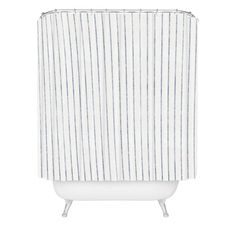 a shower curtain with blue and white stripes on the outside, in front of a white background