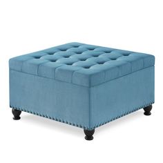 a blue ottoman with studding on the legs