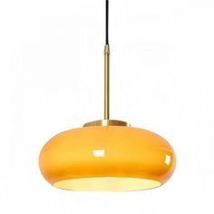 a yellow pendant light hanging from a ceiling