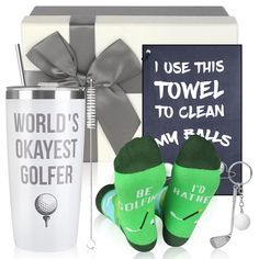 the golf gift set includes two green socks and a cup