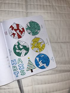 an open notebook with stickers on it