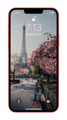 an iphone with the eiffel tower in the background