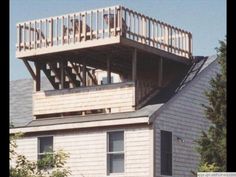 a house with a deck on top of it