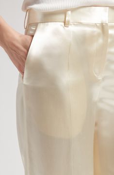 A smooth silk lining lends gliding ease to satin pants designed in a straight-leg silhouette with clean creases and plenty of pockets. 32" inseam; 24" leg opening; 12 1/2" front rise; 17" back rise (size 14) Zip fly with hook-and-bar closure Front slant pockets; back welt pocket 100% viscose Dry clean Made in Italy Designer Clothing Sleek Silk Wide Leg Pants, Sleek Silk Trousers, Sleek Silk Straight Pants, Chic Satin Tapered Leg Pants, Luxury Satin Straight Pants, Sleek Silk Straight Leg Pants, Sleek Satin Pants, Classic Silk Straight Leg Bottoms, Luxury Satin Pants For Workwear