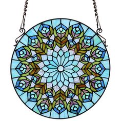 a circular stained glass window hanging on a chain