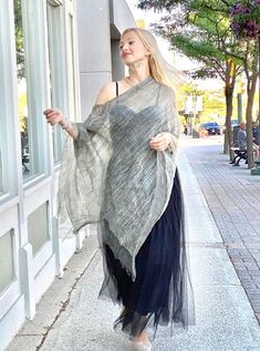 Silk Organza ShawlIn Stone Grey, Loose Cotton Top, Bridal Gauze Wrap, Beach Cover Up Our cotton silk in Stone Gray scarf is light as a feather and adds a touch of color and texture to any outfit.  Layer this summer scarf to simple tank top and jeans, use it as a beach cover up, bridesmaid shawl, bridal cover up, to add a hint of color in winter, or a poncho on cool nights. It provides endless fashion possibilities and the timeless rustic look levels up any capsule wardrobe.  This gauzy, shawl-scarf is so lightweight and folds into a compact size, so you can bring it anywhere and is great for travel. Bridal shawl:  Looking for the perfect bridal wrap? Our delicate silk organza wedding shawl perfectly matches you and your bridesmaids' dresses. This bridal cover-up has a versatile design and Organza Shawl, Sheer Shawl, Tank Top And Jeans, Summer Poncho, Bridesmaid Shawl, Simple Tank Tops, Endless Fashion, Bridal Cover Up, Top And Jeans