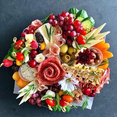 an arrangement of fruits and vegetables arranged in the shape of a circle