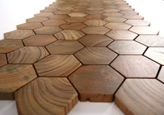 a wooden table with hexagonal patterns on it's surface and white background