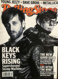 a magazine cover with two men on the front and one man in black leather jacket