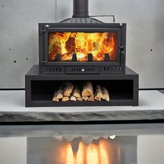 a wood burning stove sitting on top of a table