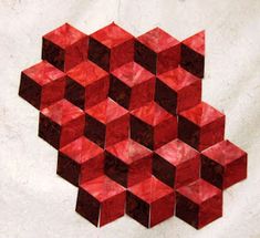 an abstract painting of red cubes on white paper