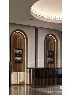 an art deco lobby with arched doorways and framed pictures on the wall, along with marble flooring