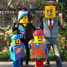 three people in lego costumes posing for a photo