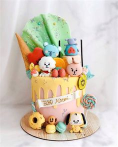 there is a cake decorated with animals and candy