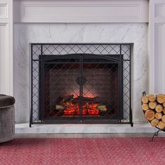 a fireplace with logs in front of it