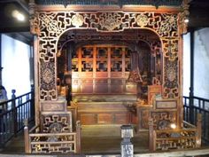 an ornate wooden structure with carved carvings on it