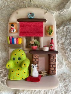 a small toy house with furniture and accessories