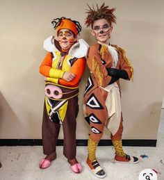 two people in costumes standing next to each other